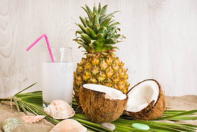 Pineapple and coconut stock image. Image of coconut, sand 50608901