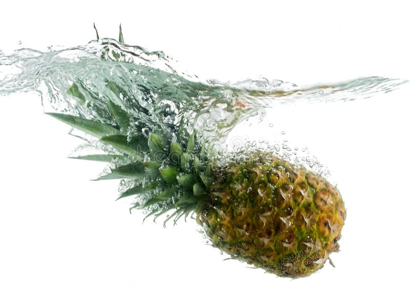 Pineapple falling in water with bubbles