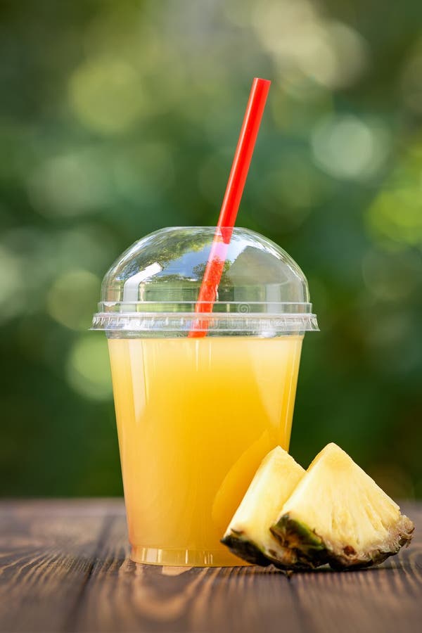 https://thumbs.dreamstime.com/b/pineapple-juice-disposable-plastic-cup-fresh-wooden-table-outdoors-take-away-glass-summer-refreshing-drink-156283128.jpg