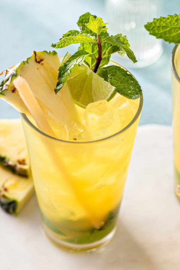 Pineapple Mojito with Limes and Mint and a Slice of Pineapple Stock