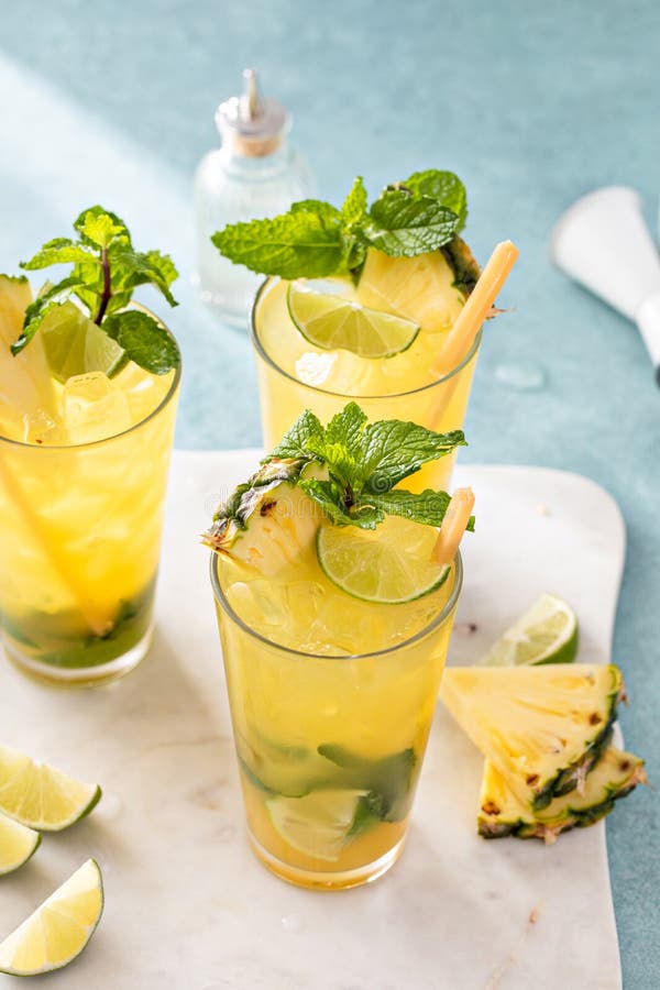 Pineapple Mojito with Limes and Mint and a Slice of Pineapple Stock