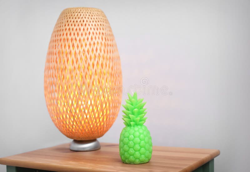 Pineapple Shaped Candle and Lamp on Bedside Table Stock Photo Image