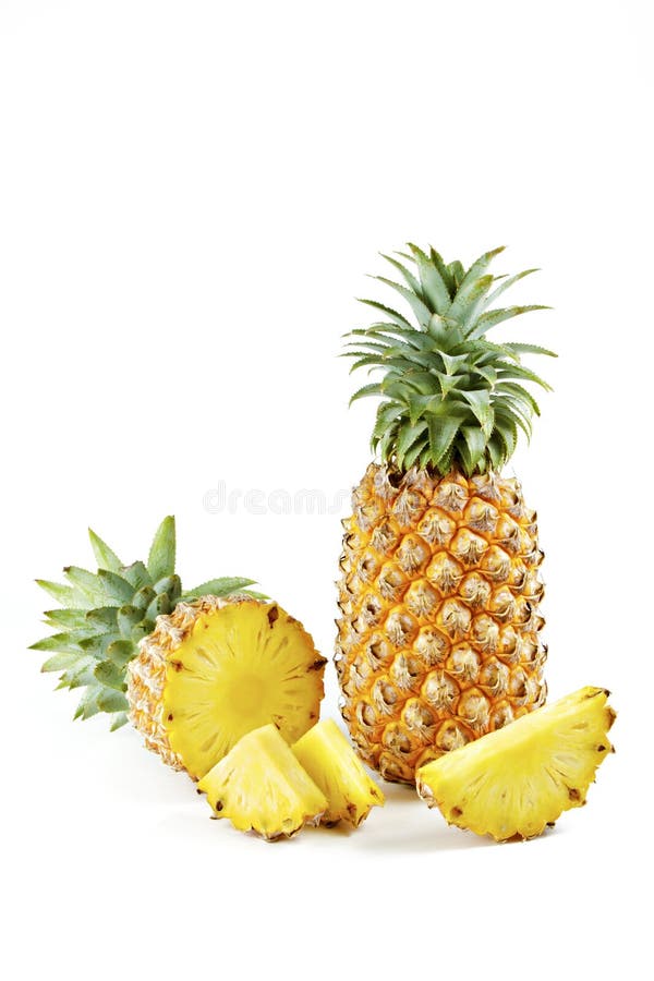 Pineapple with slices on white background