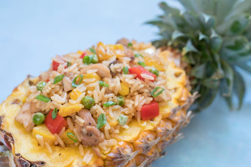 Pineapple Stuffed with Fried Rice, Chicken and Vegetables Stock Photo