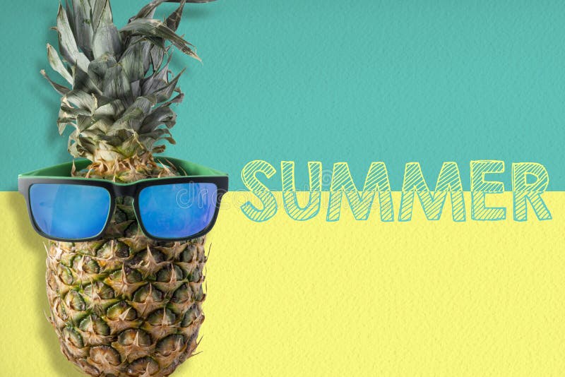 Pineapple wearing sunglasses on summer background