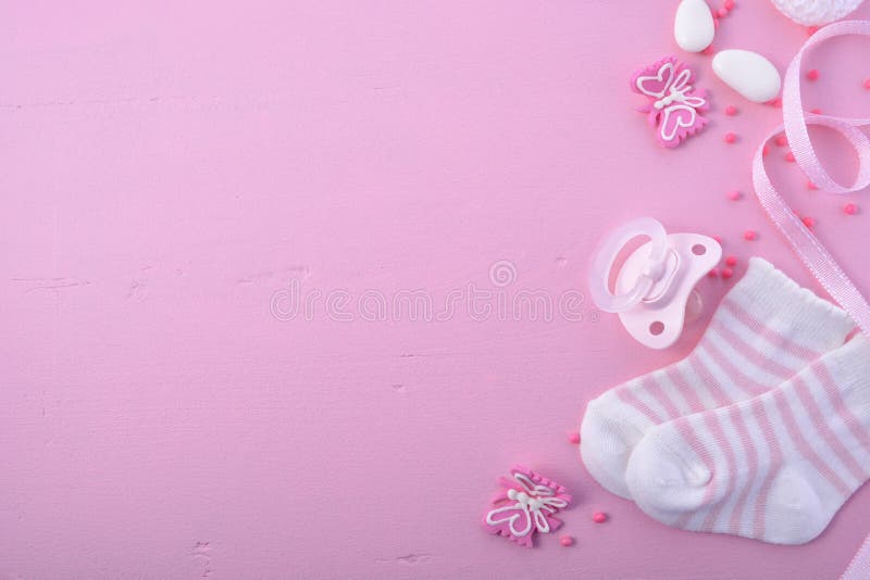 Its a Girl pink theme Baby Shower or Nursery background with decorated borders on pink wood background. Its a Girl pink theme Baby Shower or Nursery background with decorated borders on pink wood background.