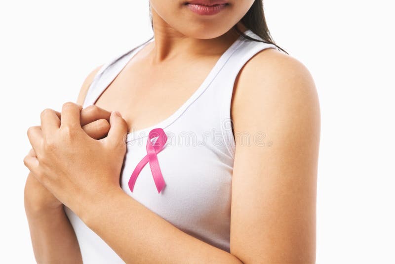 Pink badge on woman chest for breast cancer cause