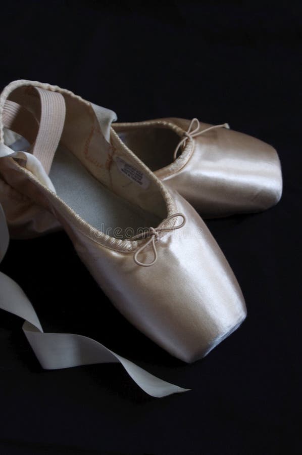 Pink Ballet Pointe Shoes with Ribbons on Black Background Stock Image ...