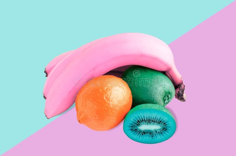 Pink bananas, blue kiwi and red lemon still life, on pink and blue background. Flat lay