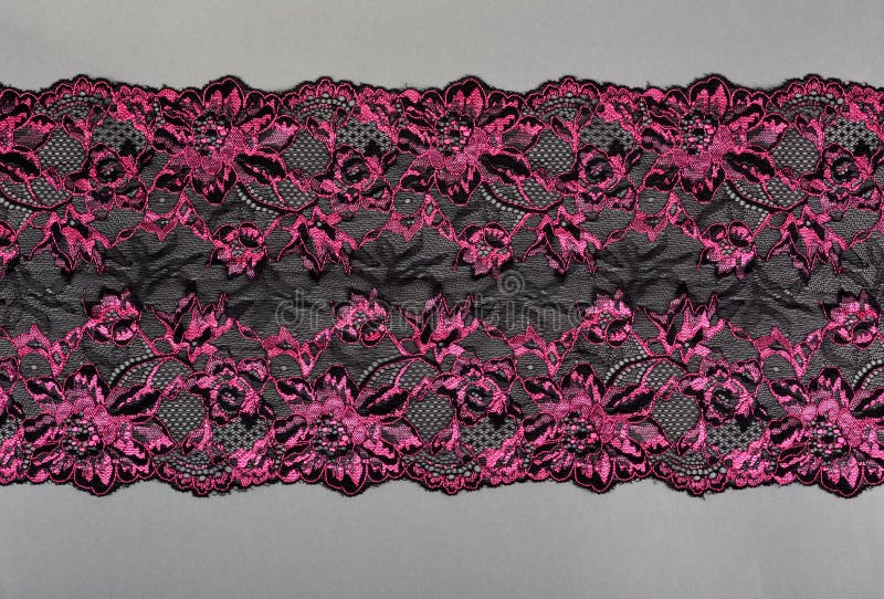 Color Straight Strip of Lace Fabric on a Gray Background. Elastic