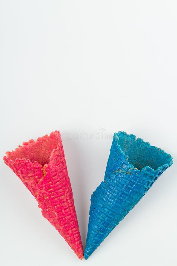 Pink and Blue Ice Cream Waffle Cones on White Background. Stock Image