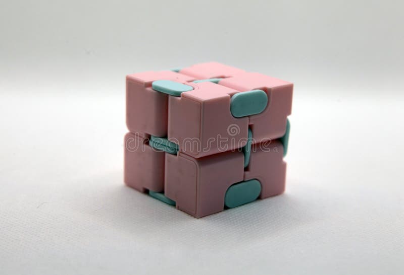 Pink and blue infinity cube with white background stock photo
