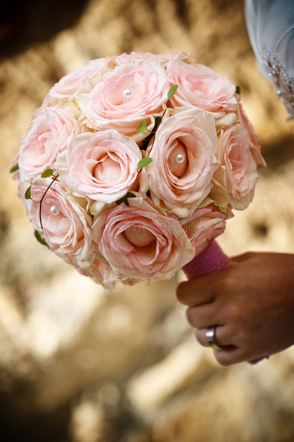 Pink bouquet in brides hand