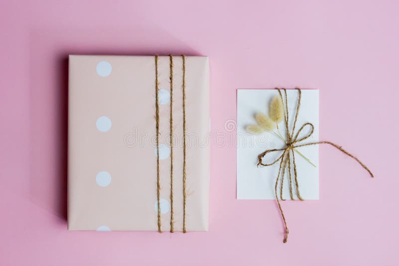 A pink box with letter on pink background with copy space. royalty free stock photography