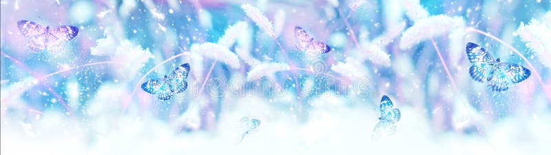 Pink butterflies in flight against the background of wild grass in the snow. Fabulous winter spring image. Magic garden. Winter wo