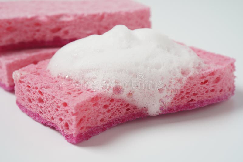 Pink Cleaning Sponge in Soap Foam on White Background Stock Image