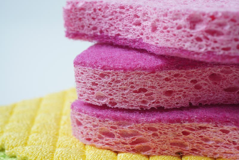 Pink Cleaning Sponge in Soap Foam on White Background Stock Image