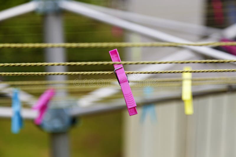 Pink clothespin on drying rack in Umea royalty free stock photo Pink clothespin on drying rack in Umea royalty free stock photo