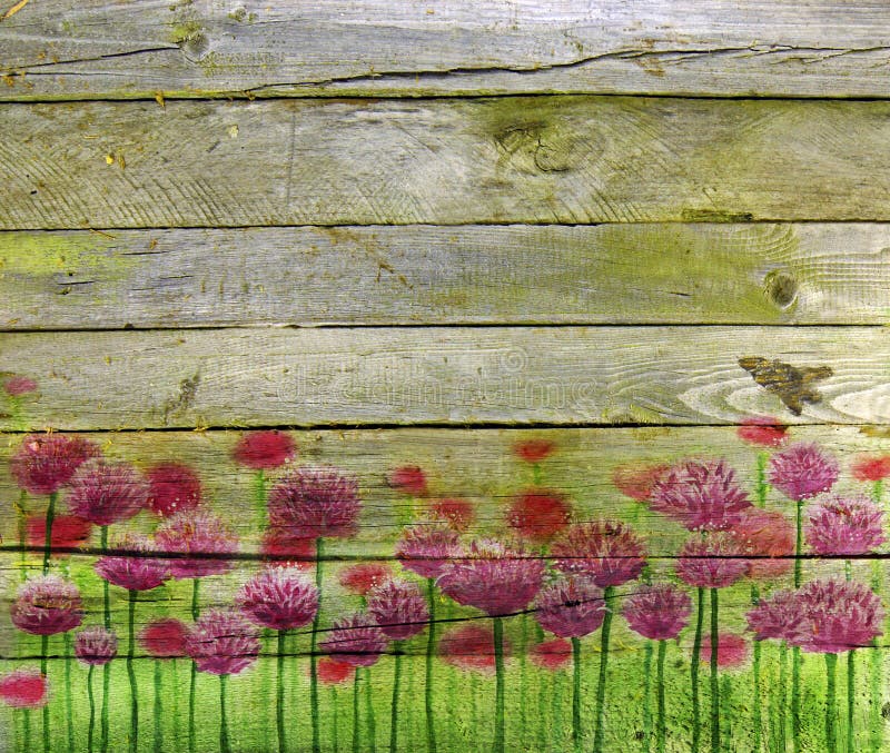 Pink clover on wooden planks