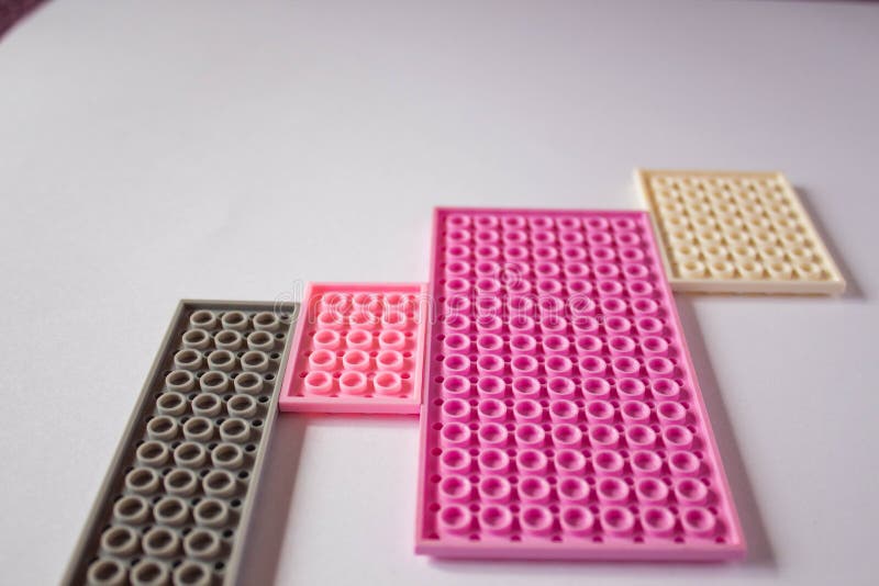 Pink constructor on a white background. Texture. Minimalism concept, Flat lay, top view, background royalty free stock image Pink constructor on a white background. Texture. Minimalism concept, Flat lay, top view, background royalty free stock image