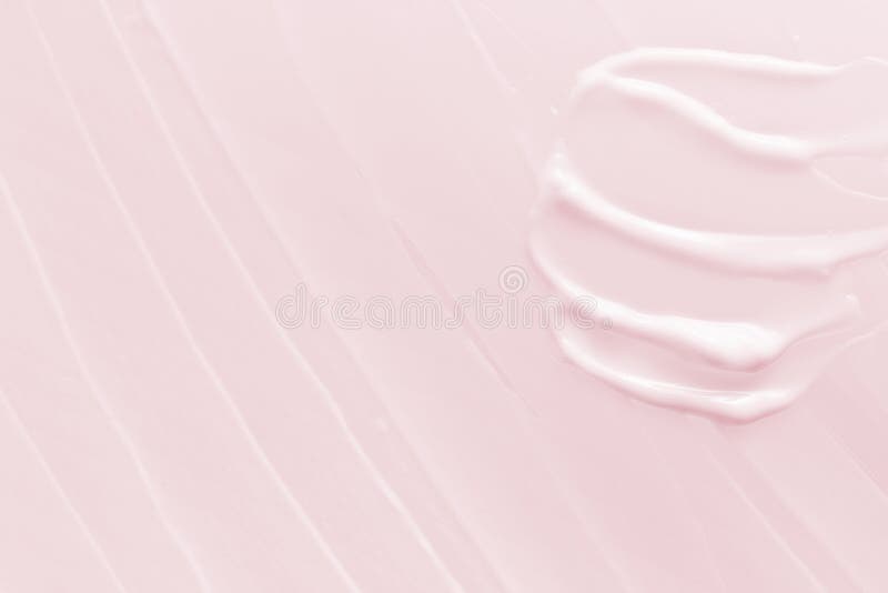 Pink cosmetic cream texture background. Skincare lotion moisturizer smear