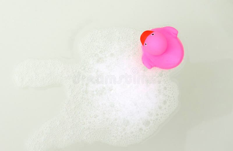 Pink duck in a bathtub stock image. Image of plastic 134265865