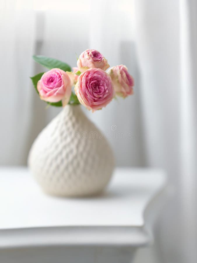 Pink flowers in white vase stock photo. Image of flower 73371872