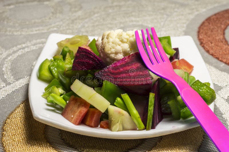 Pink fork and green salad stock photo. Image of health 35797250