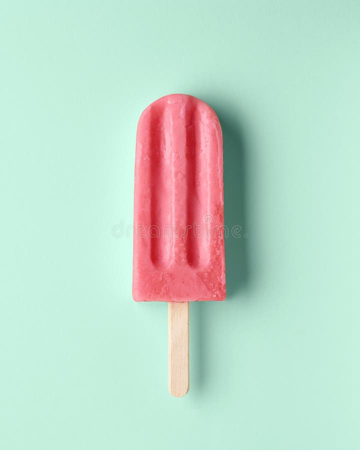 Pink fruit and berry popsicle on pastel mint background. Watermelon and strawberry flavor. Pink fruit and berry popsicle on pastel mint background. Watermelon and strawberry flavor