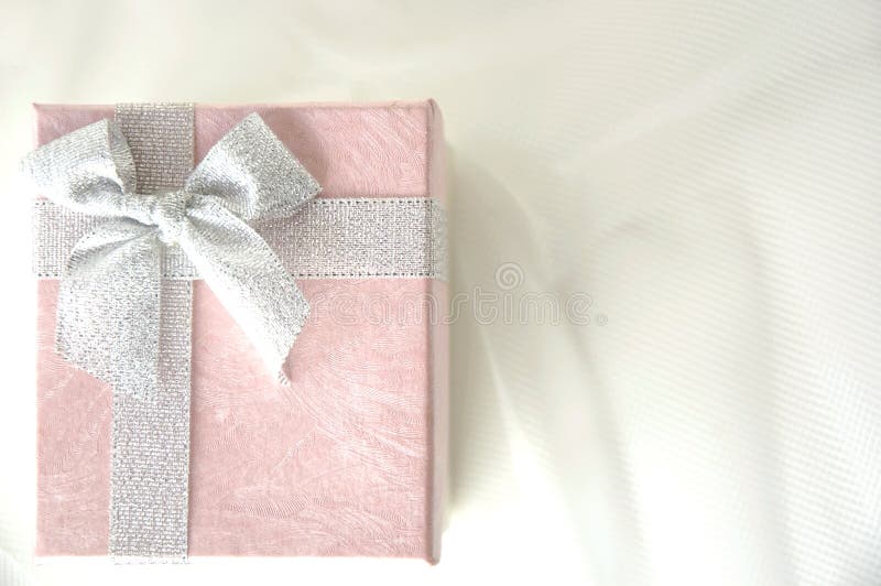 Pink gift box with silver ribbon