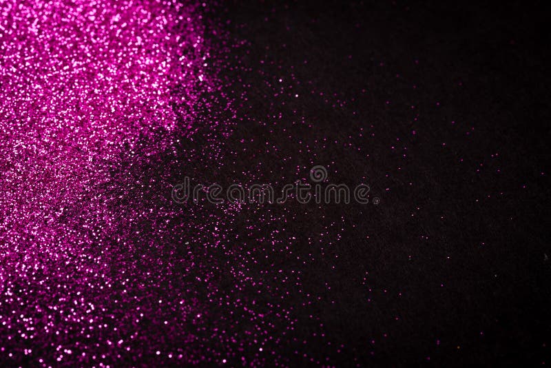 Pink glitter on black backgrund with copy space royalty free stock photo