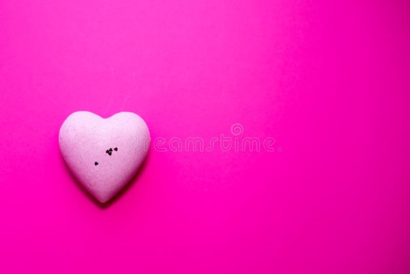 pink heart on pink background. copy space. concept of love. valentine`s day.flat lay. wedding poscard