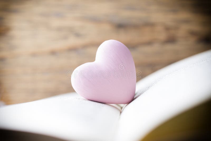 Pink heart of the book. Greeting cards.