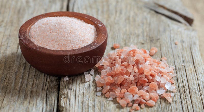 Pink Himalayan salt on a table royalty free stock photos