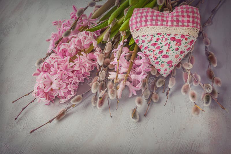 Pink hyacinth, willow twigs and heart