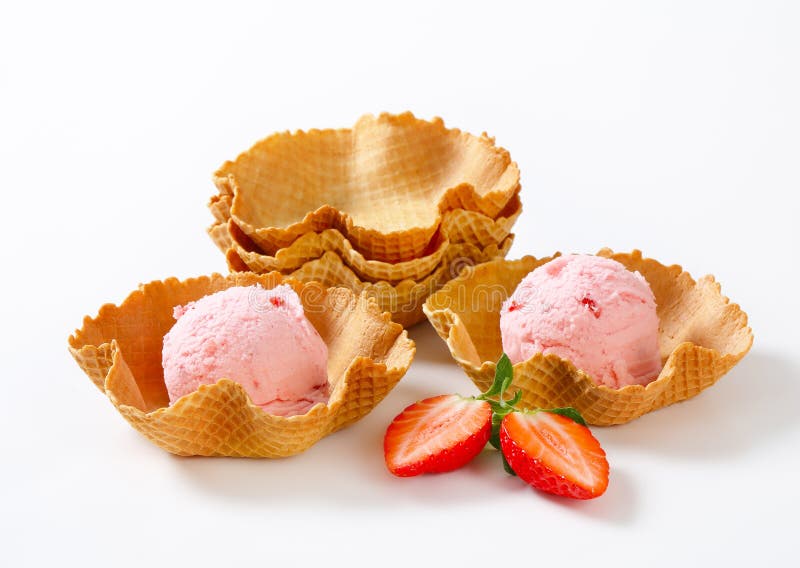 Pink ice cream in waffle baskets