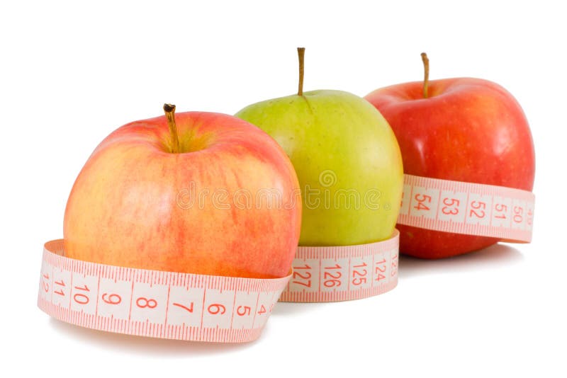 Pink measuring tape and three apples