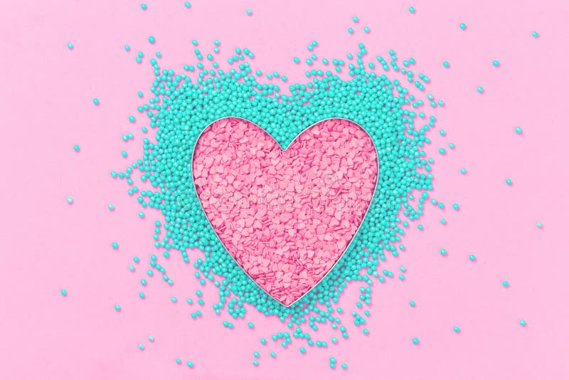 Pink and mint sprinkles sweet heart shape flat lay