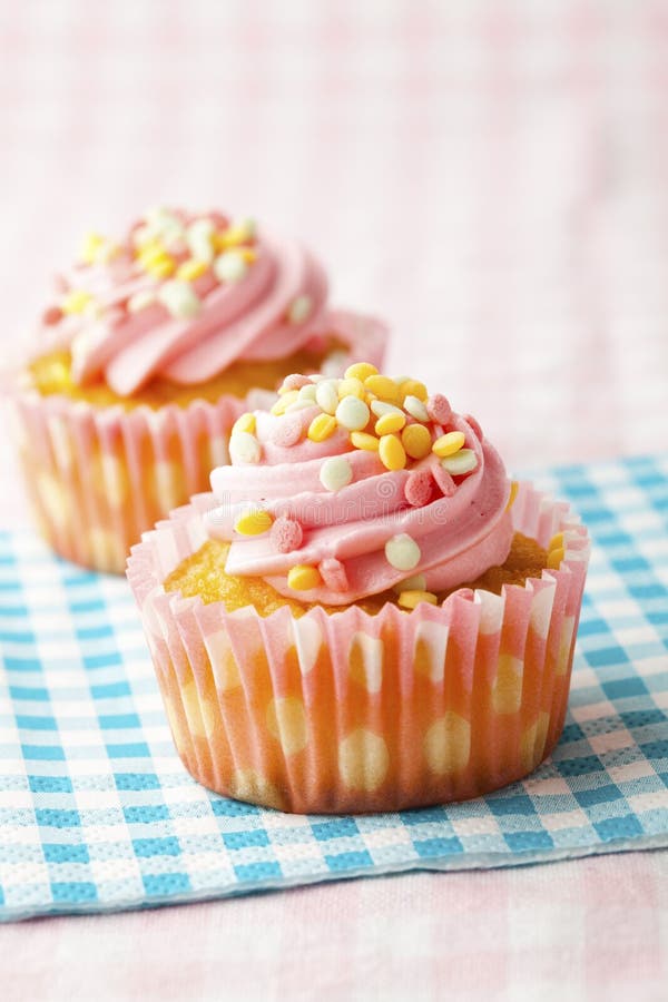Pink muffins with candles stock photo. Image of macro 23496684