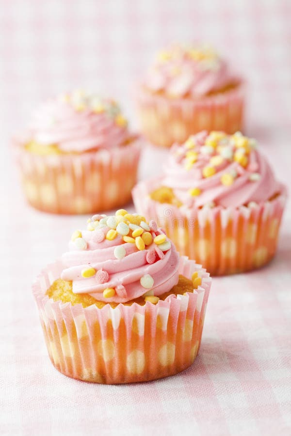 Pink muffins with candles stock photo. Image of macro 23496684