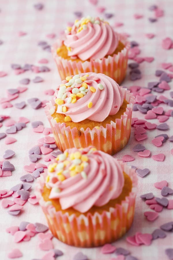 Pink muffins with candles stock photo. Image of macro 23496684
