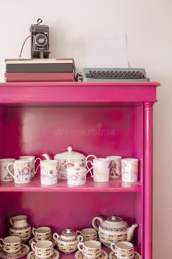 Pink Painted Sideboard with Tea Sets and Vintage Decorative Items Stock