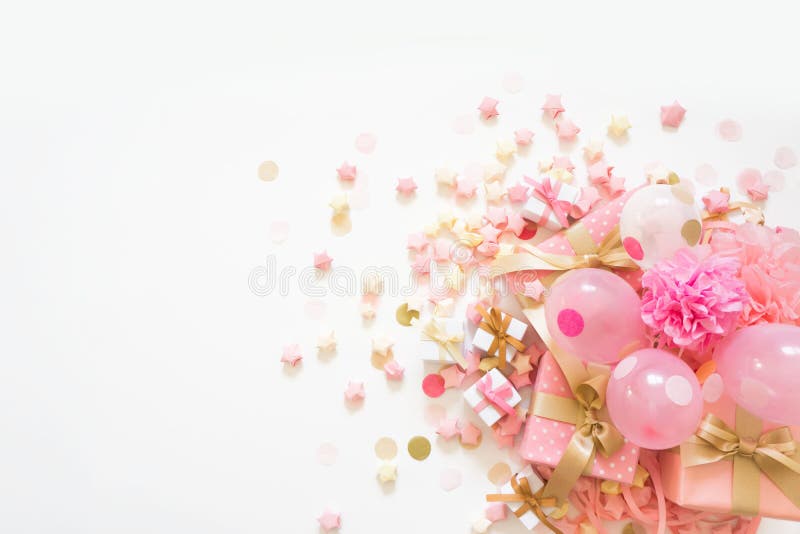 Delicate pink party background with streamers for celebrating with  scattered confetti Stock Photo