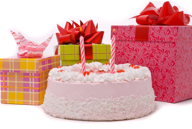 Pink pie with two candles and gifts in boxes