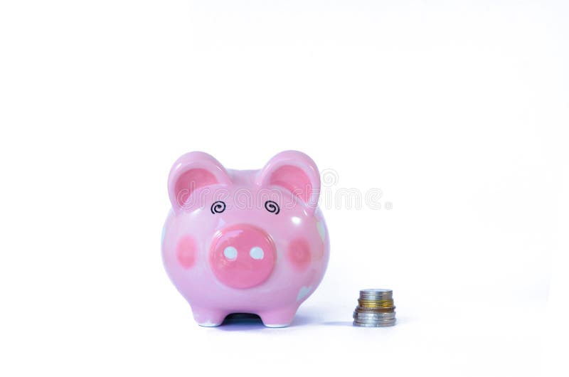 Pink piggy bank and coins isolated on white royalty free stock photo Pink piggy bank and coins isolated on white royalty free stock photo