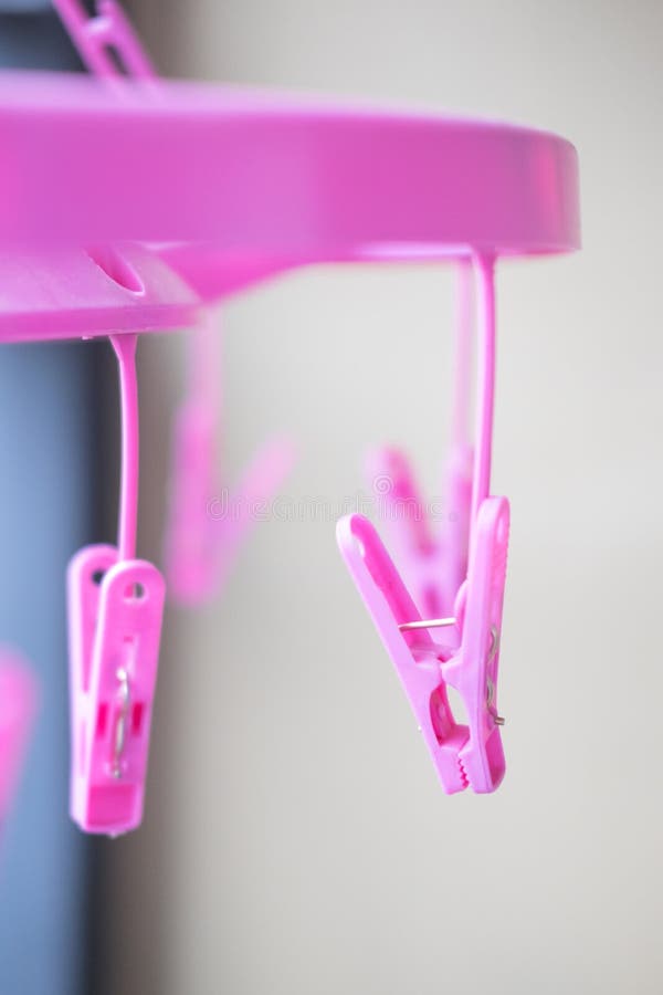 Pink plastic clothespins stock image. Image of pink, cord 67444523