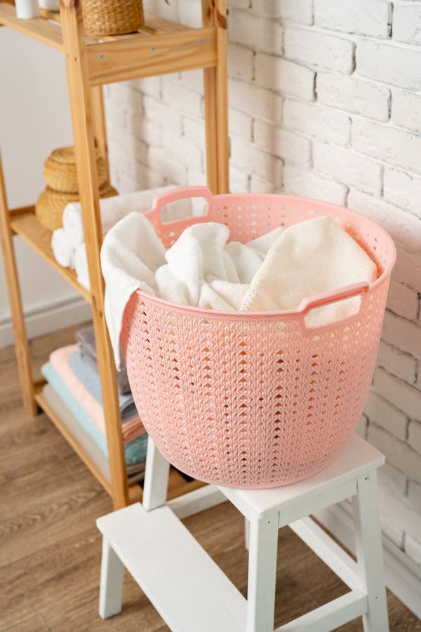 Pink Plastic Laundry Basket in a Bathroom Stock Photo Image of