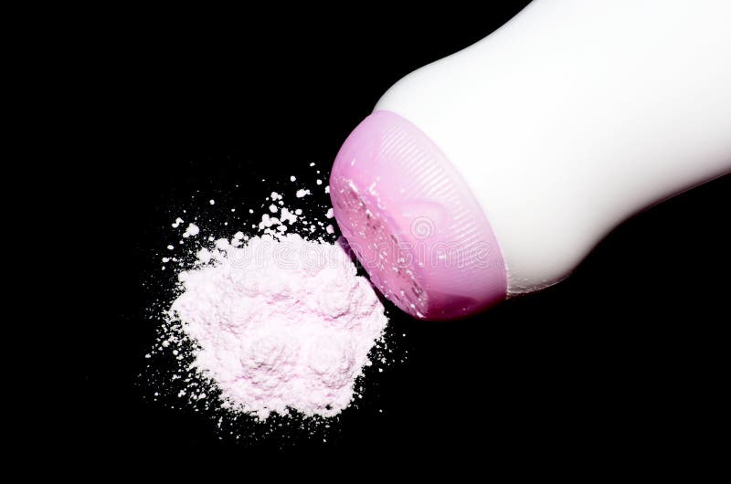 Pink powder on black background