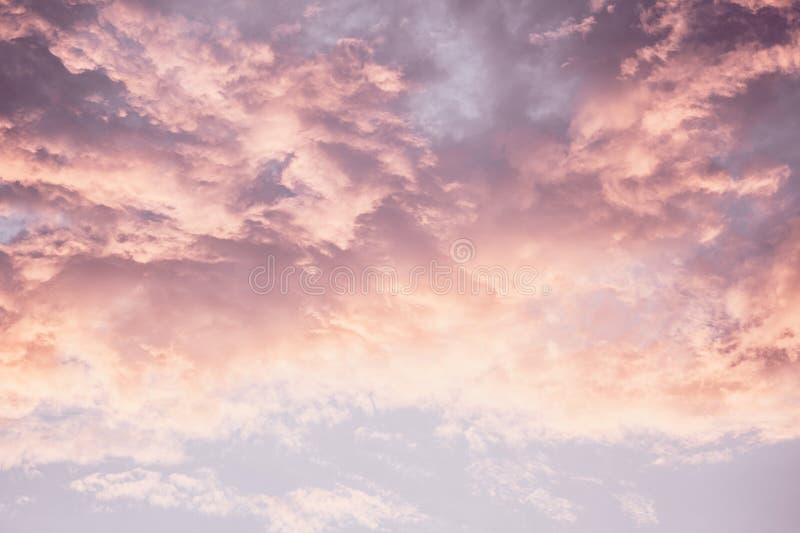 A Pink and Purple Sky with Clouds in the Background Stock Image Image