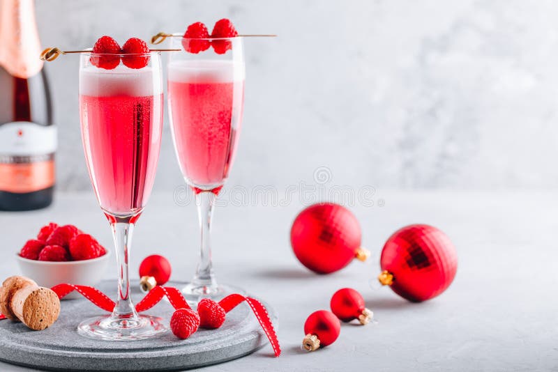 Pink Raspberry Mimosa Cocktail with champagne or prosecco